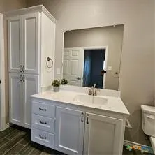 a bathroom with a sink and a mirror