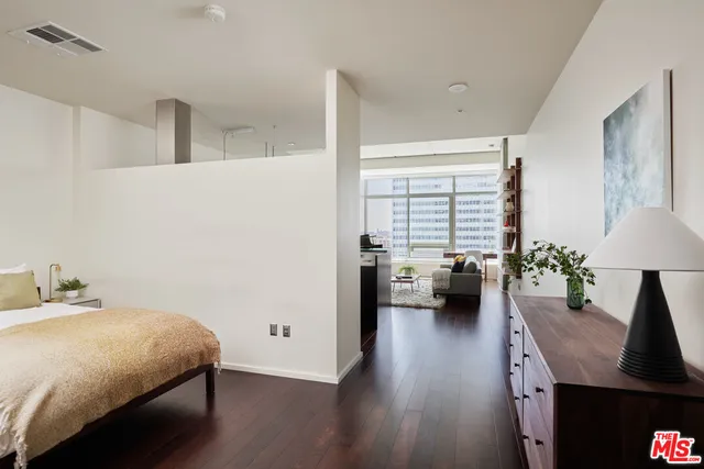 a bedroom with a bed and a couch