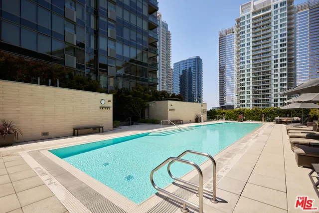 a view of a swimming pool with a lounge chairs