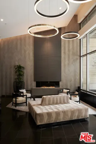 a bathroom with a granite countertop sink a mirror and shower