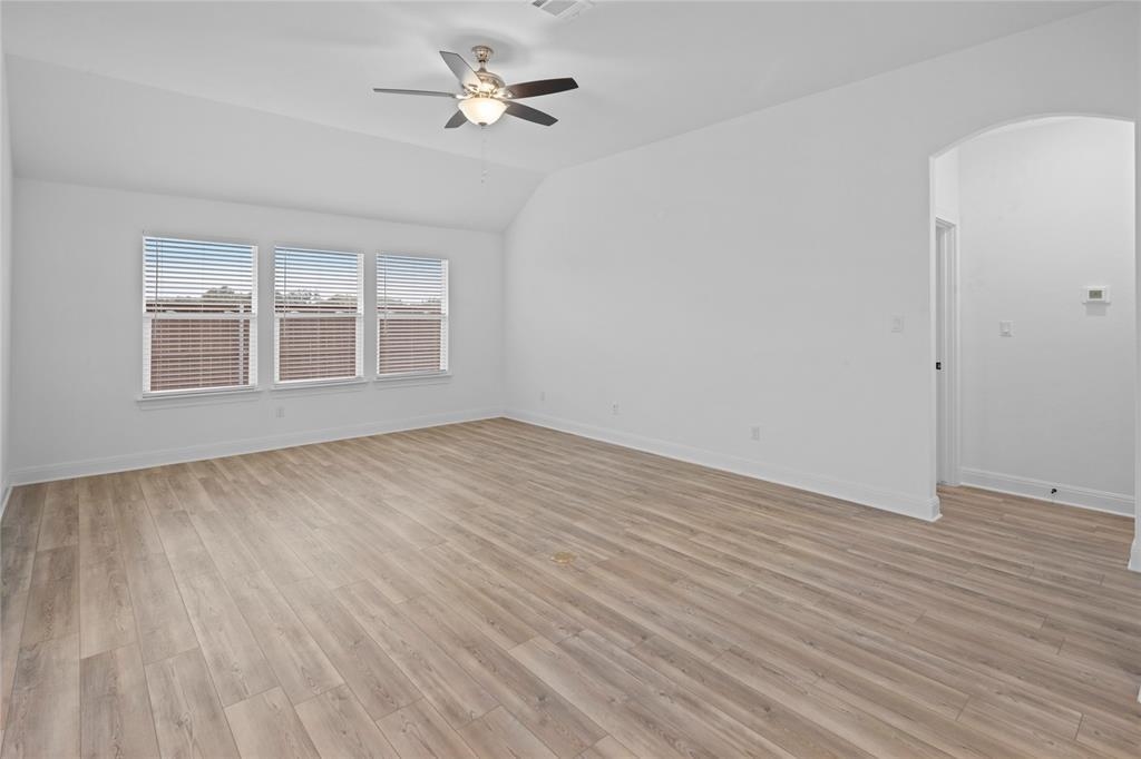 181 Slenderleaf Drive Marble Falls, TX 78654 - Photo 5 of 29 a view of empty room with wooden floor and fan