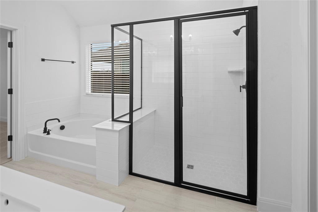 181 Slenderleaf Drive Marble Falls, TX 78654 - Photo 8 of 29 a bathroom with a bathtub and a shower