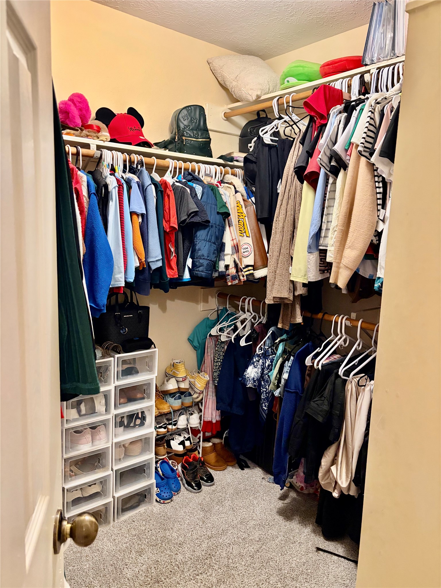 5329 Tallowpine Terrace Katy, TX 77493 - Photo 12 of 21 a view of walk in closet with clothes and shoes