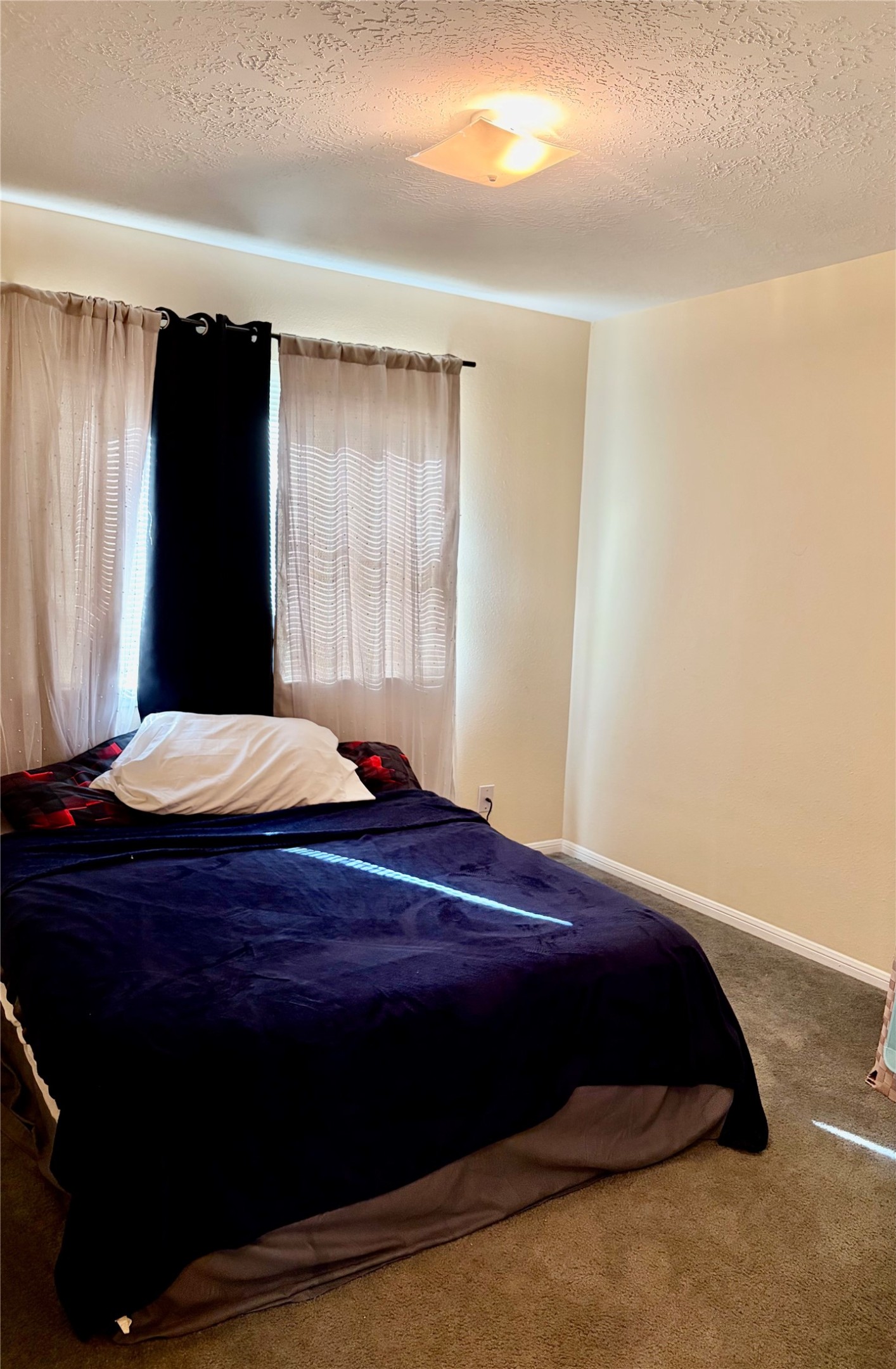 5329 Tallowpine Terrace Katy, TX 77493 - Photo 15 of 21 a bed sitting in a bedroom next to a window