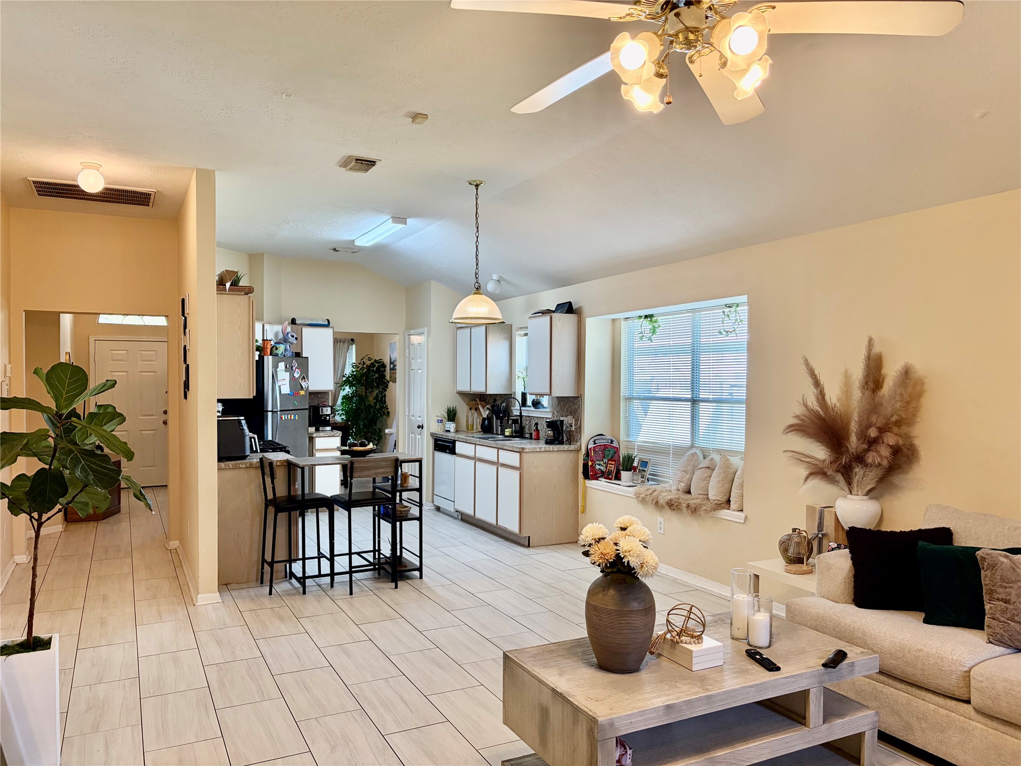 5329 Tallowpine Terrace Katy, TX 77493 - Photo 9 of 21 a living room with furniture a chandelier and a dining room