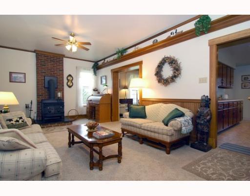 676 Callery Road Evans City, PA 16033 - Photo 2 of 18 Living Room. Living room complete with wood burning fireplace and judges paneling.