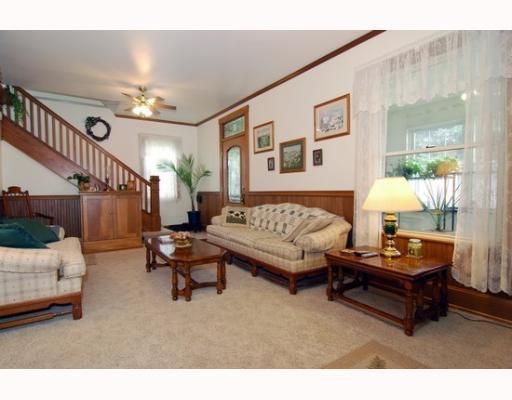 676 Callery Road Evans City, PA 16033 - Photo 3 of 18 Living Room. Living room with view of front door that leads to enclosed porch with slate floor.