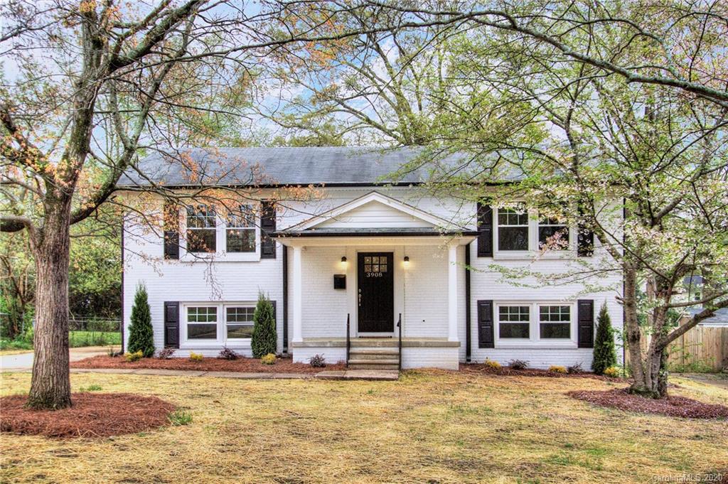 3908 Farmview Road Charlotte, NC 28205 - Photo 1 of 25 a view of a house with a large tree