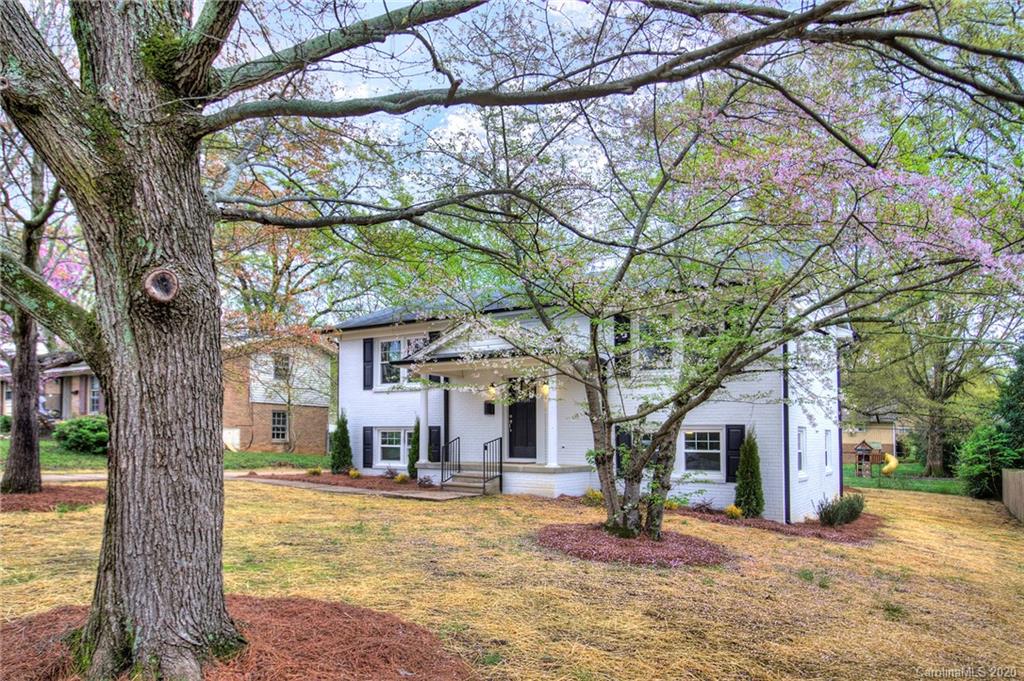3908 Farmview Road Charlotte, NC 28205 - Photo 4 of 25 a house with trees in front of it