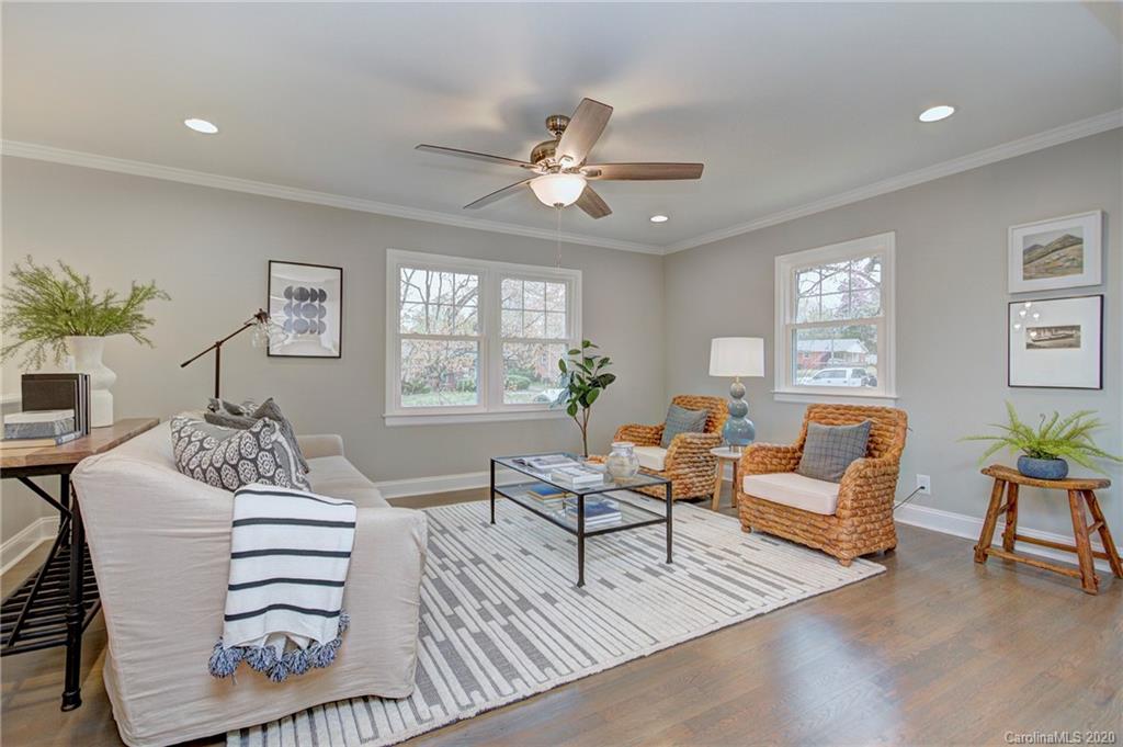 3908 Farmview Road Charlotte, NC 28205 - Photo 8 of 25 a living room with furniture a fireplace and a window