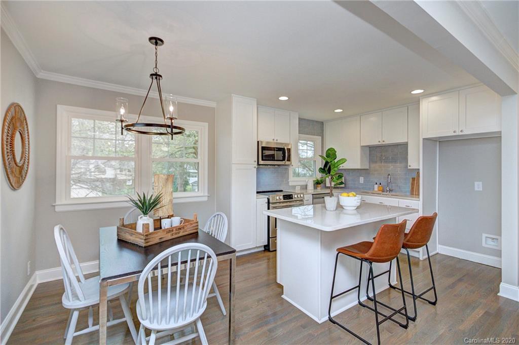 3908 Farmview Road Charlotte, NC 28205 - Photo 10 of 25 a view of a dining room with furniture window and outside view