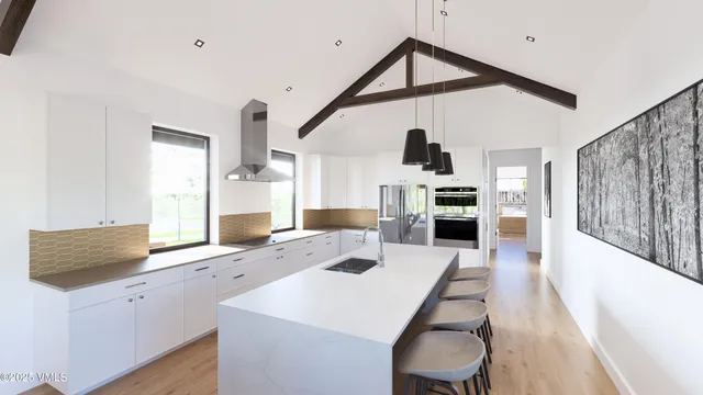 a open kitchen with white cabinets and stainless steel appliances