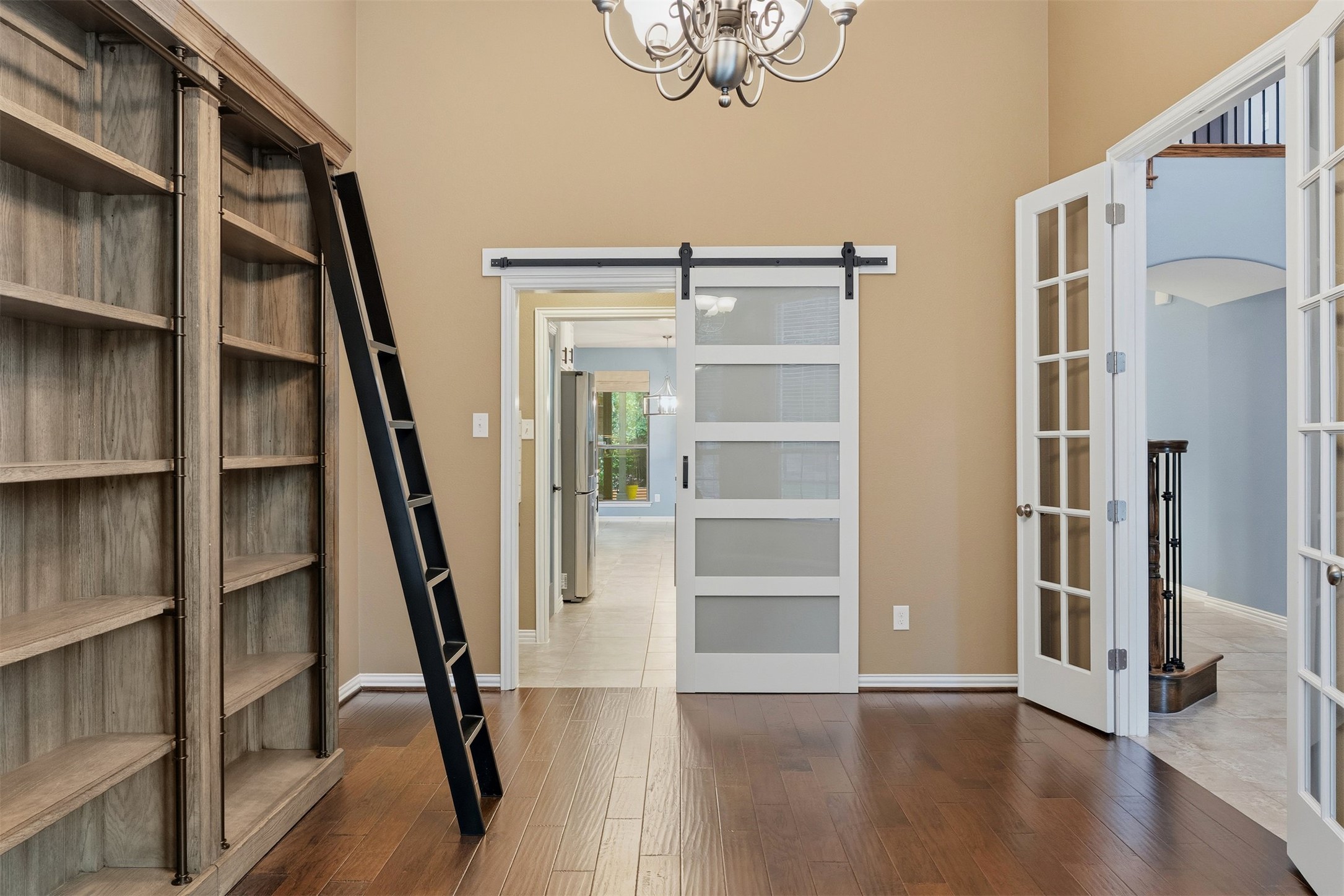 3935 Bowstring Bend Cedar Park, TX 78613 - Photo 7 of 39 The office features a second door for easy movement, connecting directly to the kitchen area via the butler’s pantry