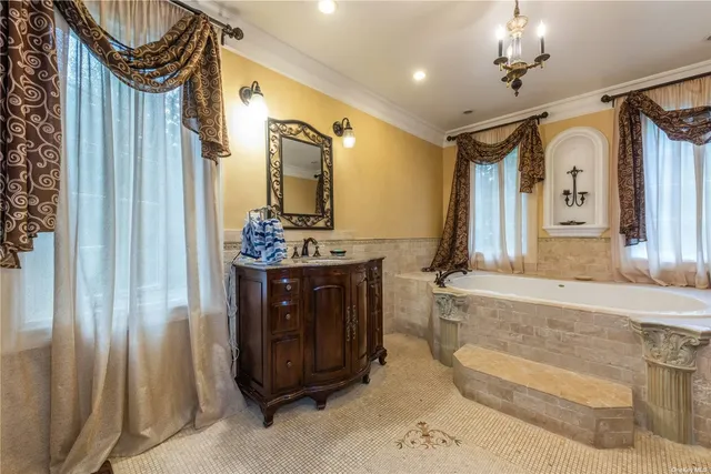 a bathroom with a sink a vanity and a mirror