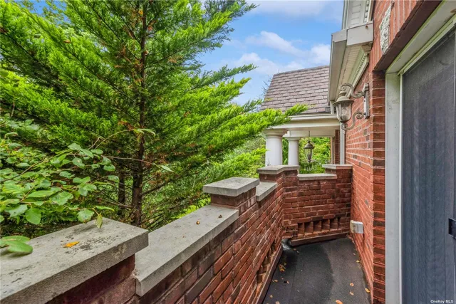 a view of balcony with wooden floor and outdoor seating