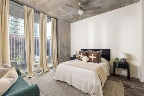 a bed room with a bed and a couch