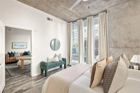 a bedroom with furniture and a window