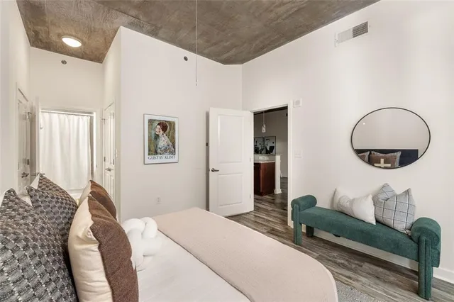 a bedroom with bed and a couch