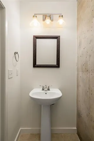 a bathroom with a sink a mirror and a toilet