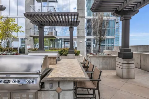 a patio with a table and chairs