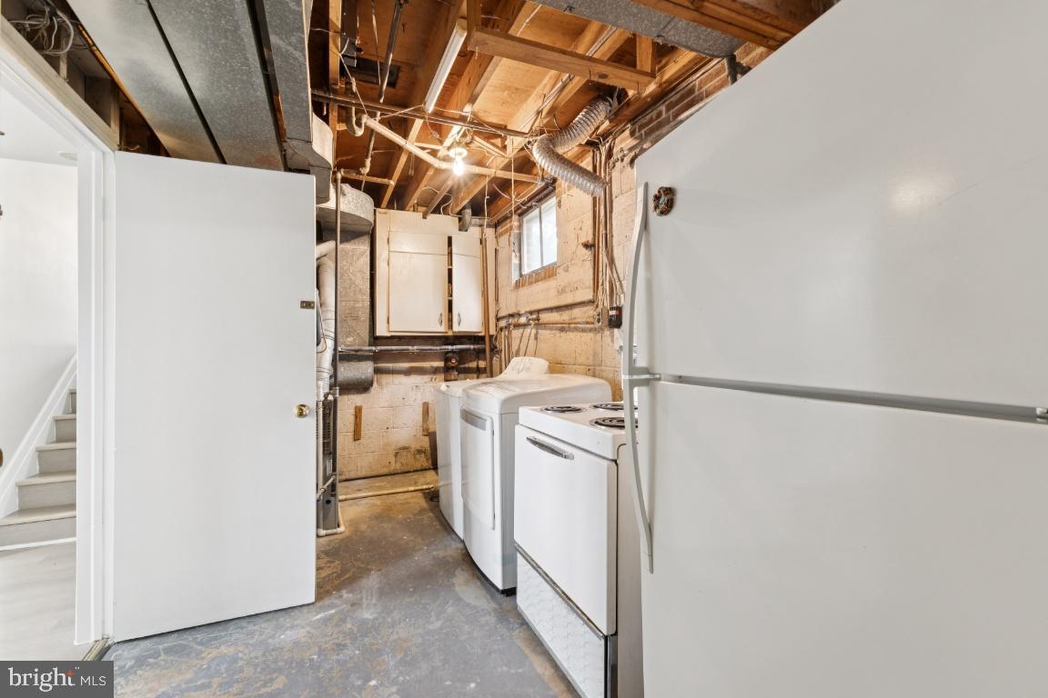 5307 Kepler Lane Springfield, VA 22151 - Photo 13 of 31 Functional basement laundry area with appliances.
