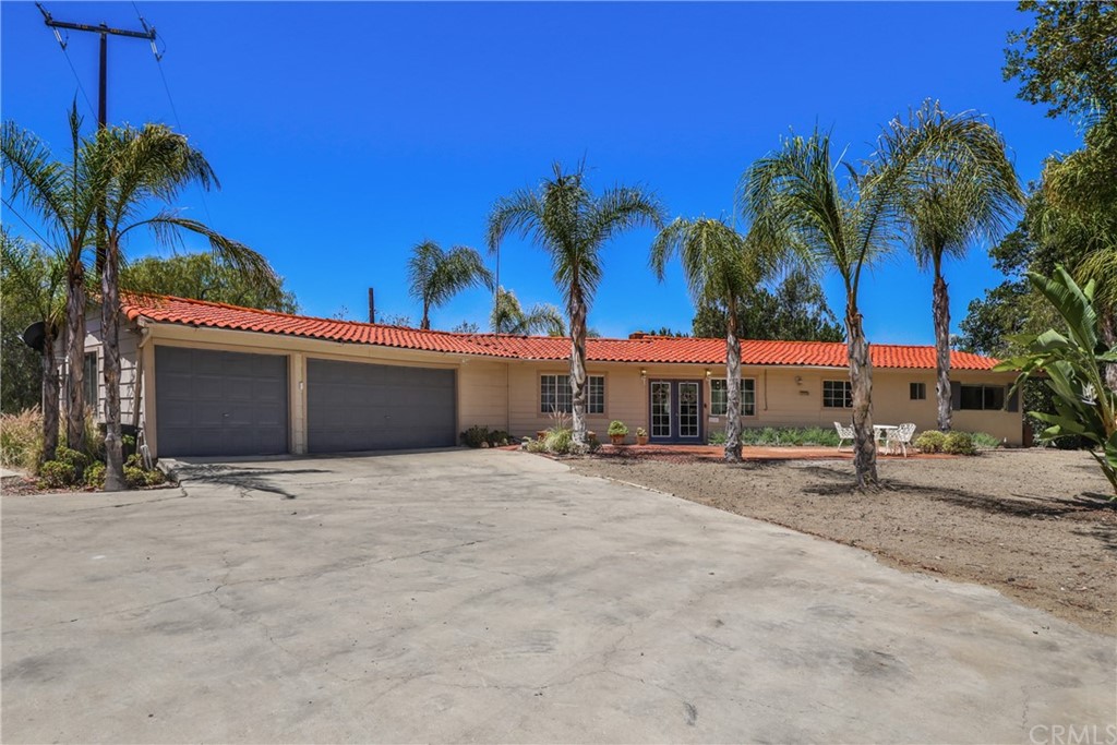 40460 Little Ross Road Fallbrook, CA 92028 - Photo 1 of 1 a view of a house with a yard and garage