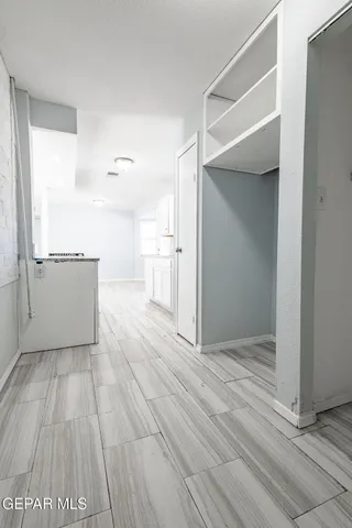 a view of a room with racks on the wall