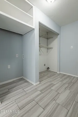 a kitchen with granite countertop white cabinets and sink