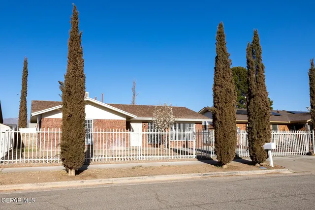 a view of a street with a building in the background