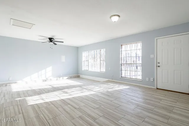 a bathroom with a granite countertop double vanity sink and mirror