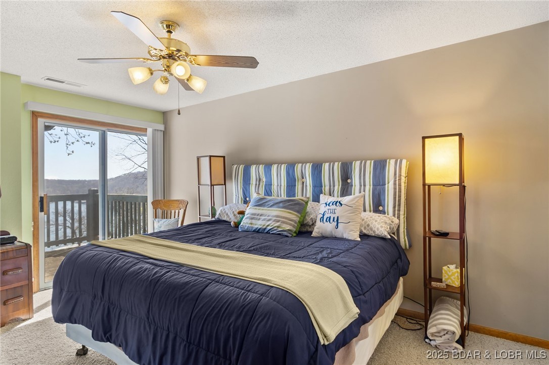 1436 Cherokee Road, Unit 2A Lake Ozark, MO 65049 - Photo 11 of 26 primary bedroom ensuite