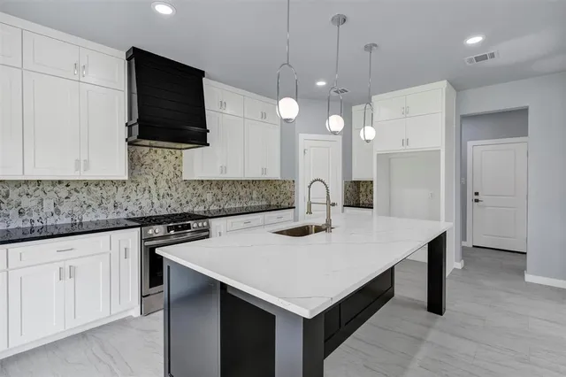 a kitchen with a sink and a microwave