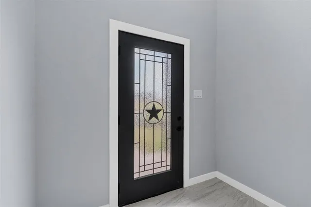 a view of a hallway with windows