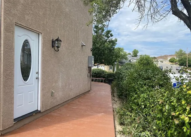 a kitchen with stainless steel appliances granite countertop a refrigerator sink and stove