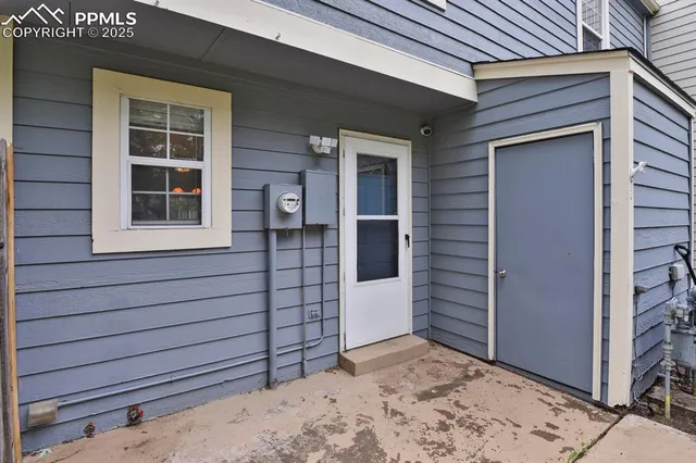 a view of front door and bedroom