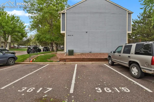 a view of a street with a back side of a house