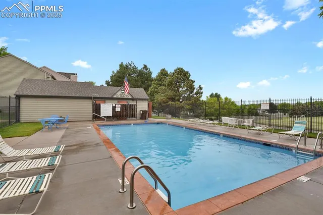 a view of a swimming pool with a patio