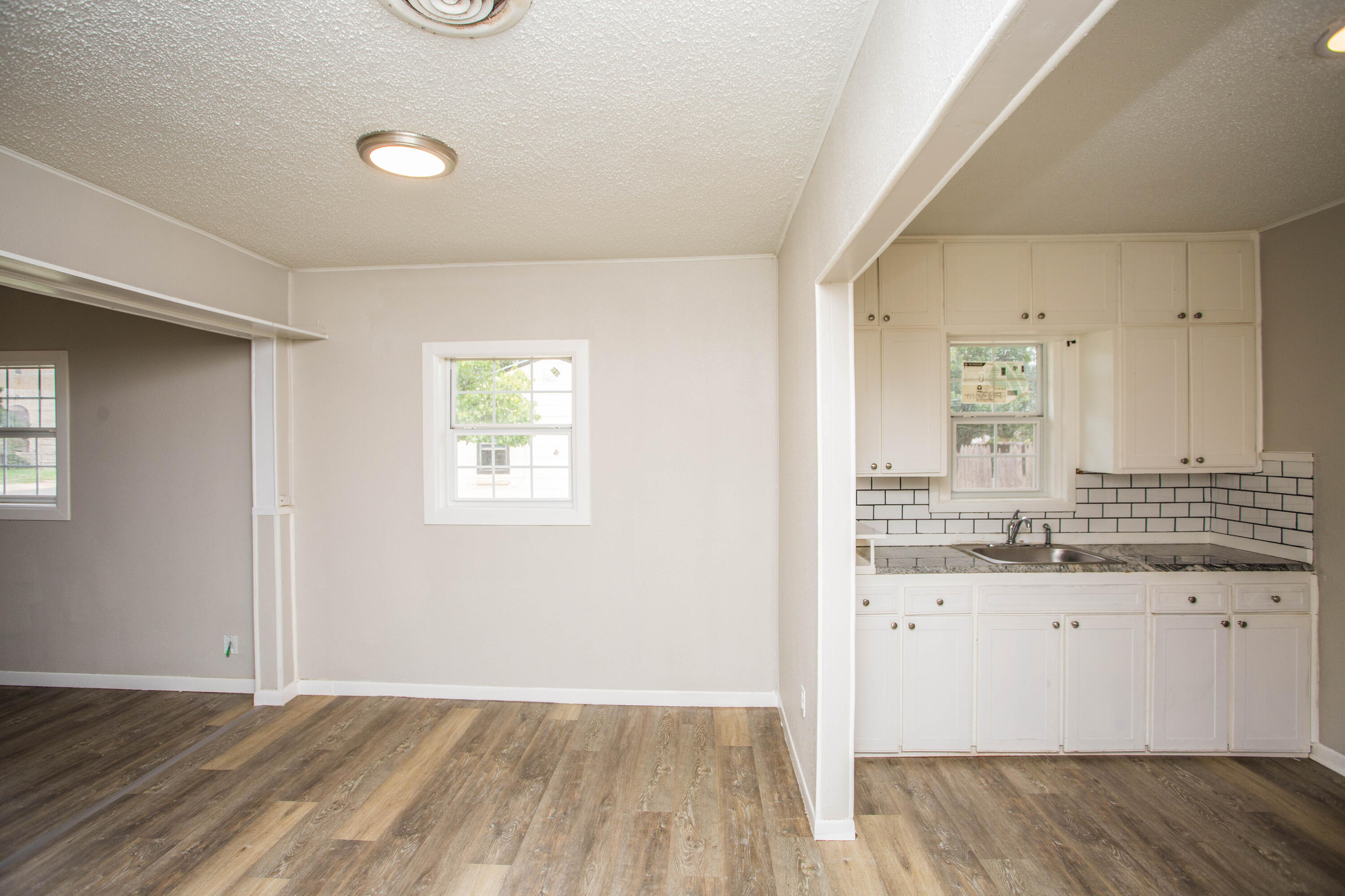3012 39th Street Lubbock, TX 79413 - Photo 13 of 31 a bathroom with a sink and a mirror