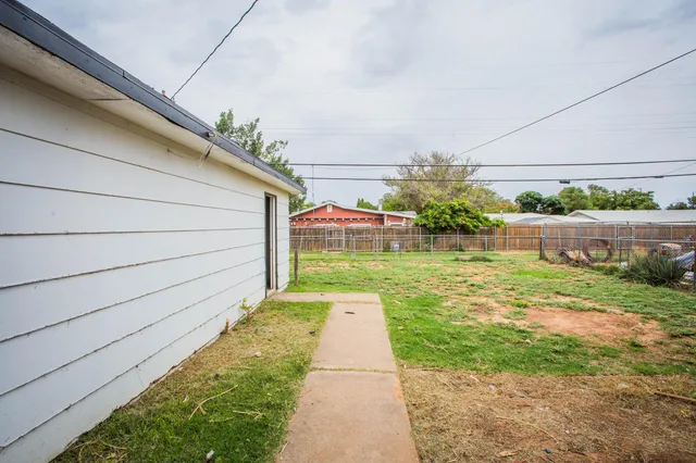 a backyard of a house with lots of green space