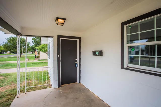 a view of an empty room with a balcony