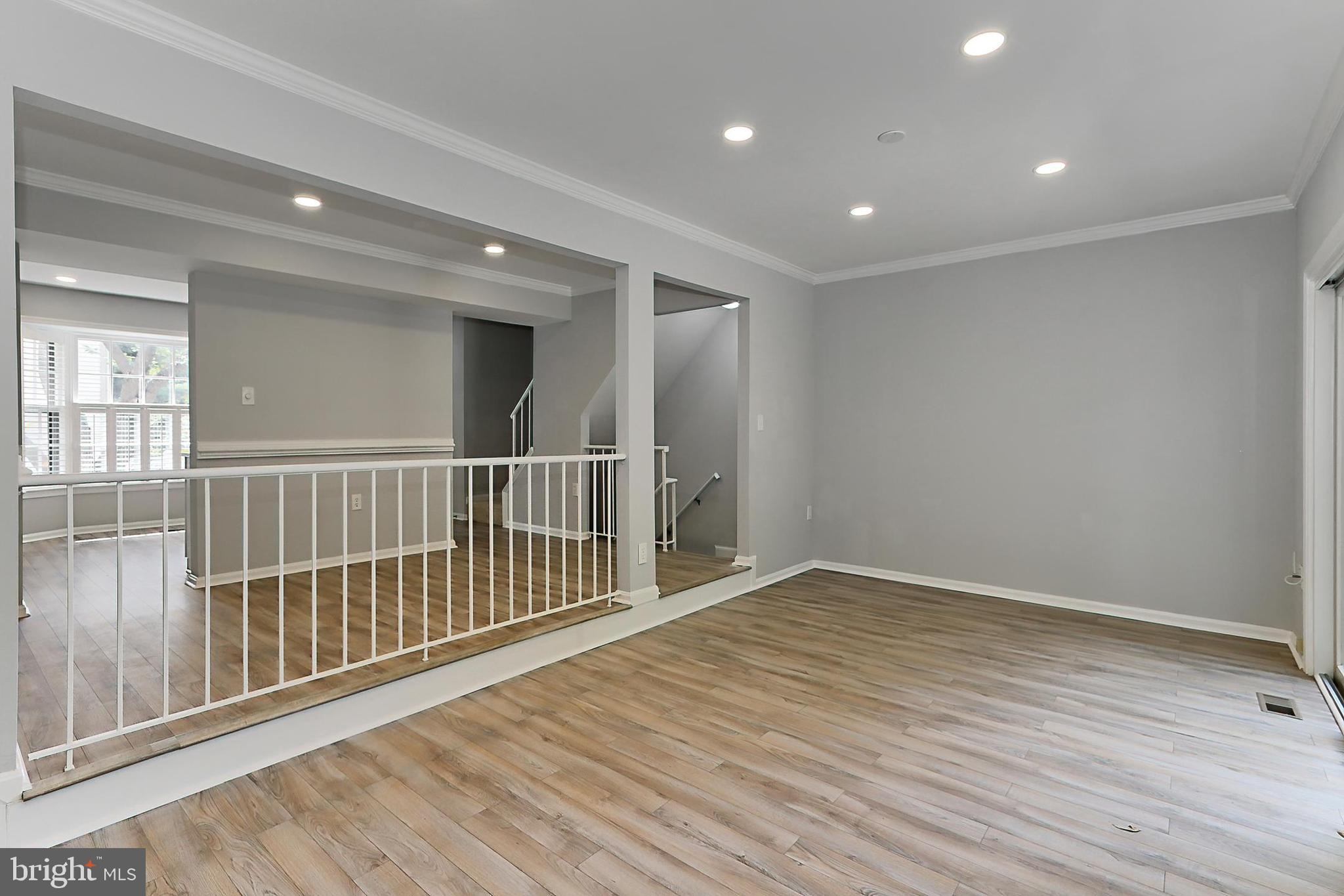 10270 Latney Road Fairfax, VA 22032 - Photo 17 of 52 Living room has LVP flooring & recessed lighting
