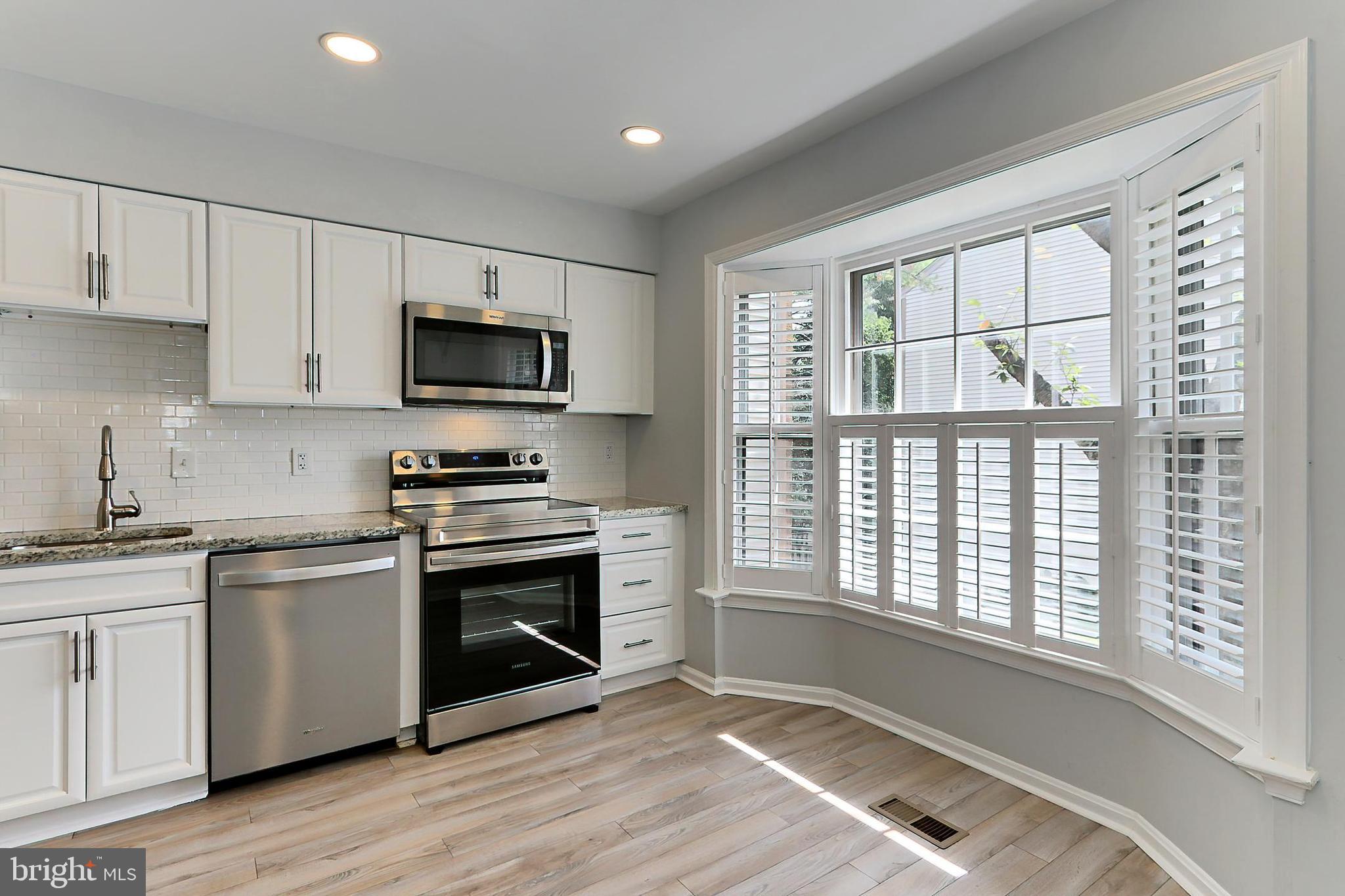 10270 Latney Road Fairfax, VA 22032 - Photo 5 of 52 Kitchen has LVP flooring & recessed lighting