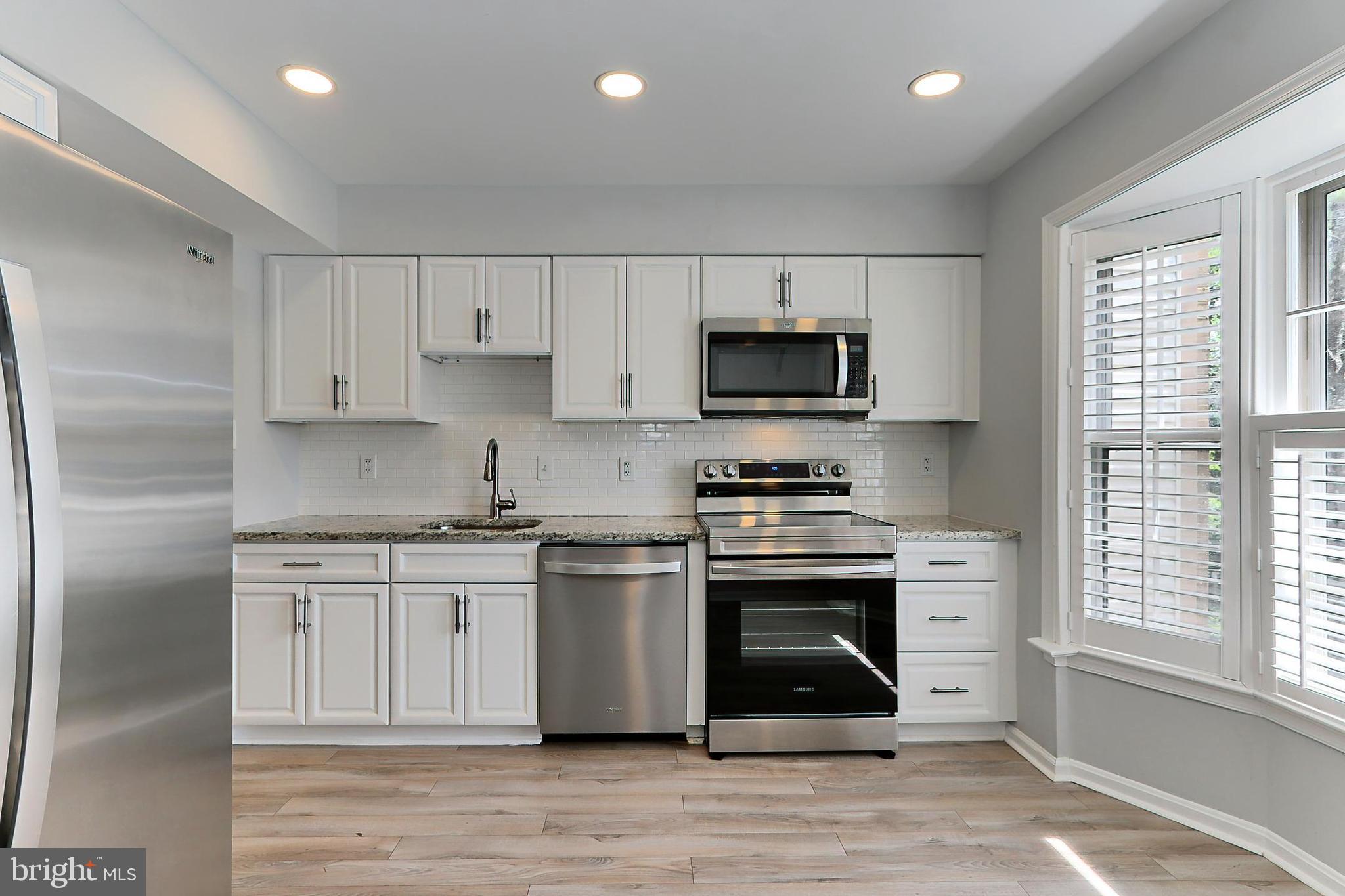 10270 Latney Road Fairfax, VA 22032 - Photo 6 of 52 White cabinetry & granite counters