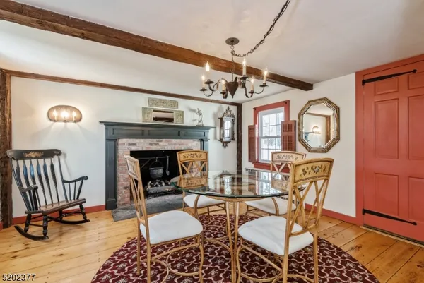 a view of a livingroom with furniture and a fireplace