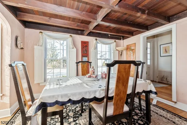 a dining room with furniture and window