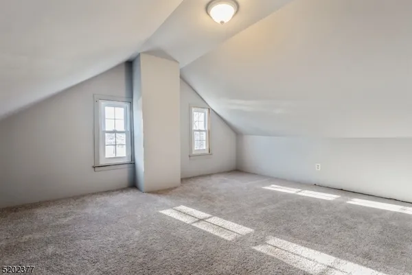 a view of an empty room with windows
