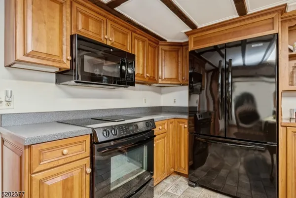 a kitchen with a stove microwave and refrigerator