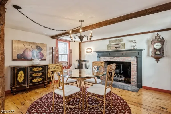 a dining room with furniture and a fireplace