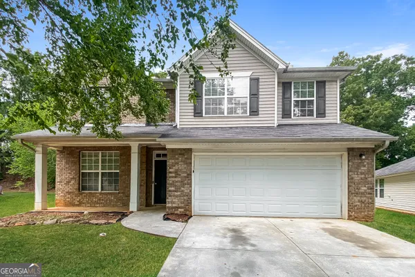 front view of a house with a yard