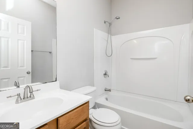 a bathroom with a sink a toilet and a bathtub